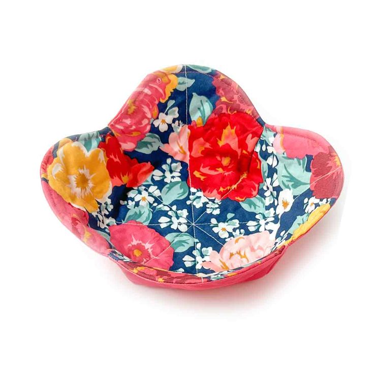 a colorful flowered bowl on a white background