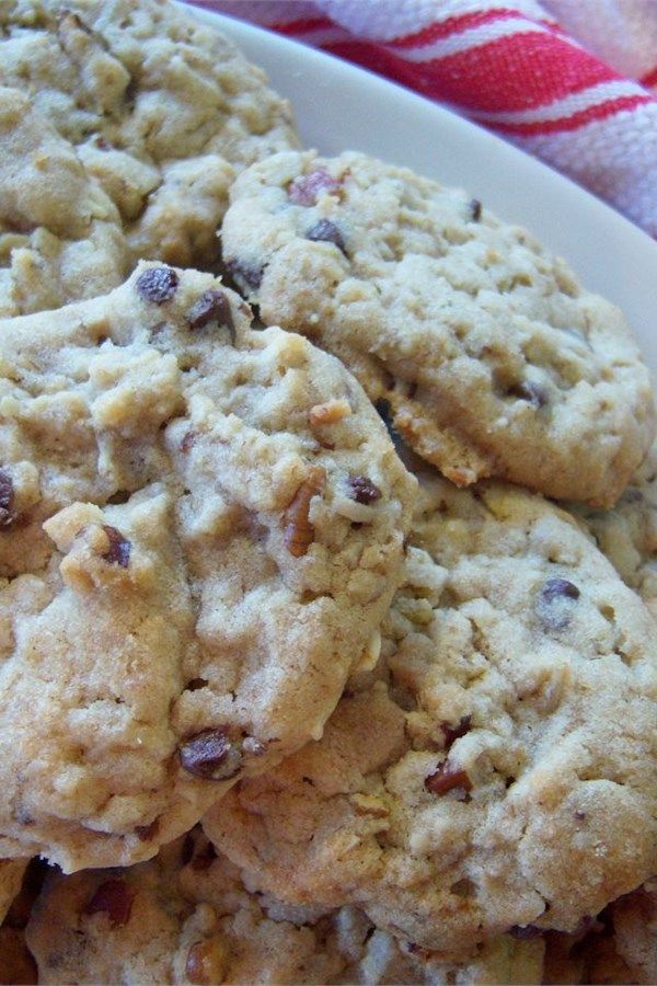 a white plate topped with cookies on top of a red and white striped table cloth