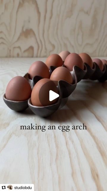 an egg tray with six eggs in it and the words making an egg arch above them