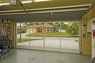 an empty garage with sliding glass doors