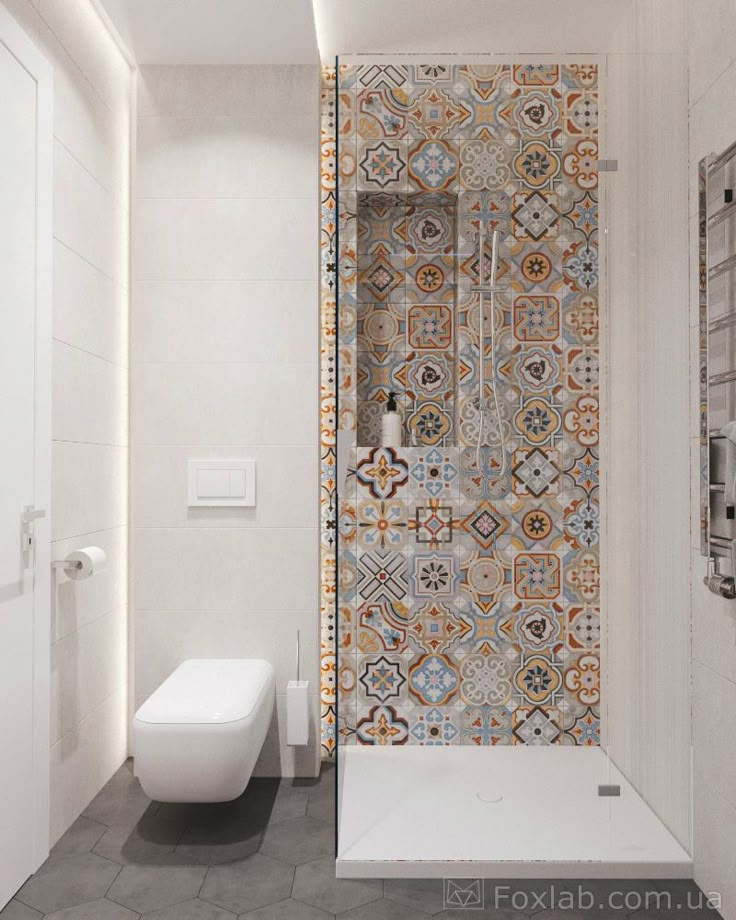 a bathroom with a toilet, shower and tiled wall in it's center area