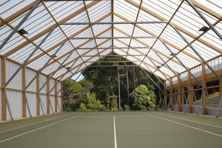 an indoor tennis court is shown in this image