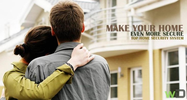 a man and woman hugging in front of a house