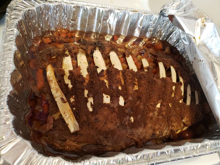 a meatloaf in foil on top of a table