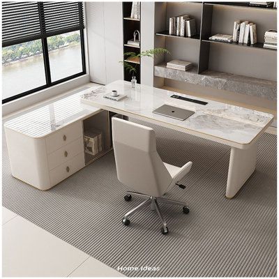 an office with a desk, chair and bookcases on the floor in front of a window