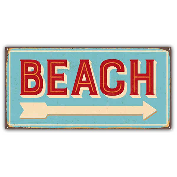 a sign that says beach with an arrow pointing to the right