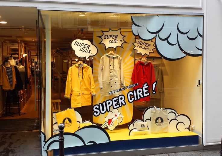 a store front window with an advertisement on it's glass and the words, super girl?