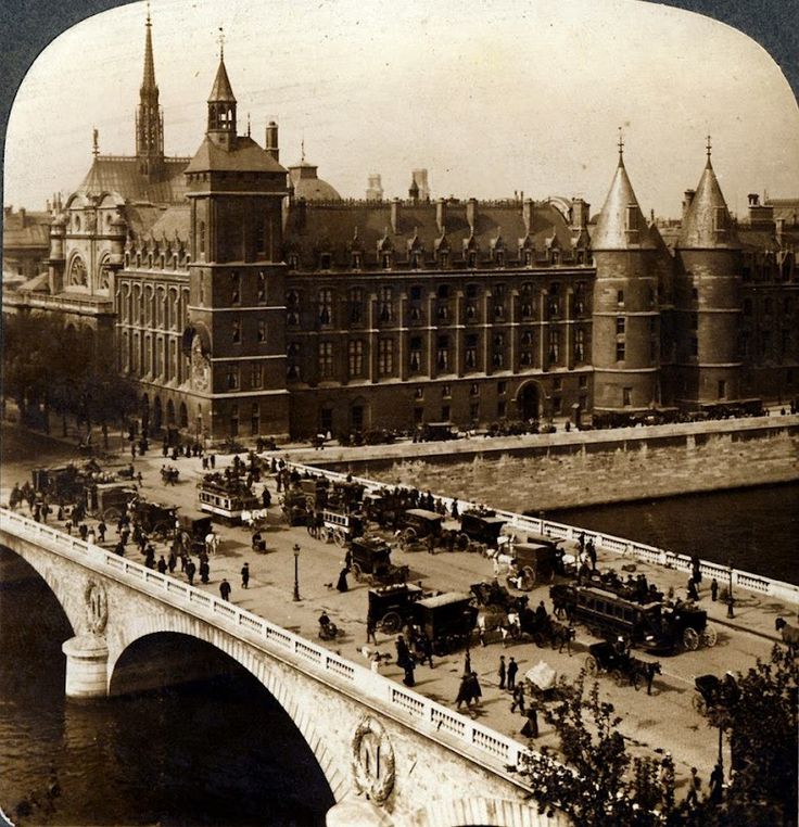 an old black and white photo of horse drawn carriages in front of a large building