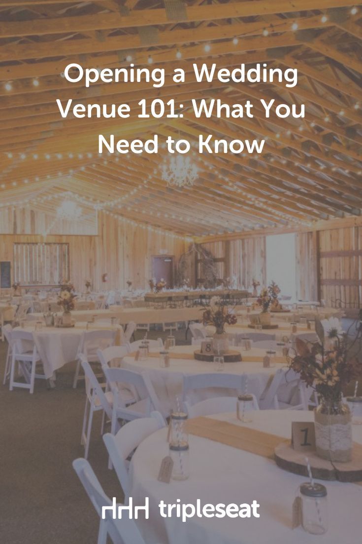 an event venue with white tables and chairs