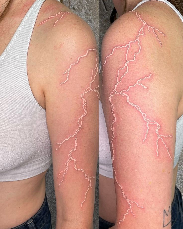 two women with lightning tattoos on their arms