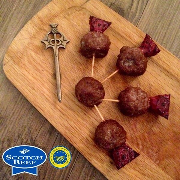 some food is sitting on a wooden cutting board