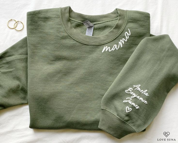 Our mama sweatshirt is the perfect gift for all moms! The embossed style lettering will leave mama feeling cozy yet chic every day. Personalize the left sleeve with the names of the mother's children and/or loved ones to make it even more special. I T E M ∙ D E T A I L S * Crewneck Sweater, 50% cotton, 50% polyester * Unisex Sizing: S, M, L, XL, 2XL Care Instructions: Machine wash cold. Tumble dry low or hang to dry. Wash inside out. Do not iron or dry clean. P R O C E S S I N G ∙ & ∙ S H I P P Mother's Day Crew Neck Sweatshirt With Lettering, Mother's Day Lettering Crew Neck Sweatshirt, Minimalist Mom, Womens Sweatshirts, Mom Sweater, Birthday Gift For Mom, New Mom Gift, Mama Sweatshirt, Personalized Clothes