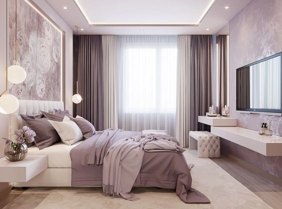 a bedroom with a large bed and purple wallpaper on the walls, along with white furniture