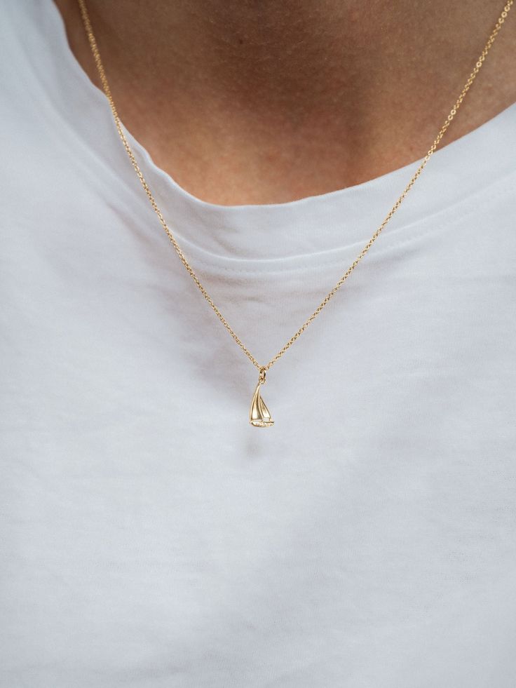 Set sail into a sea of summer adventures with our charming sailboat necklace. Wear it as a symbol of freedom, exploration, and the joy of embracing new experiences. Material CZs set in 14k gold vermeil 16" extra fine chain + 2" extender Details Each piece of Leah Alexandra jewellery is handmade in her Vancouver beachside studio. Only the finest materials are used, including 14k gold fill, sterling silver, and carefully selected semi-precious stones and pearls. Care When not being worn, always ke Sailboat Jewelry, Birthday Shopping List, Beachy Necklaces, Sailboat Necklace, School Swag, Wishlist Christmas, Beachy Necklace, Hand Jewelry Rings, Symbol Of Freedom