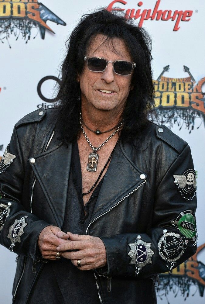 a man in black leather jacket and sunglasses