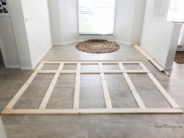 an unfinished room with white walls and tile flooring