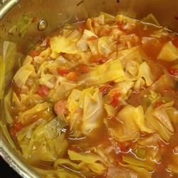 a close up view of some food in a bowl with broth and vegetables on it