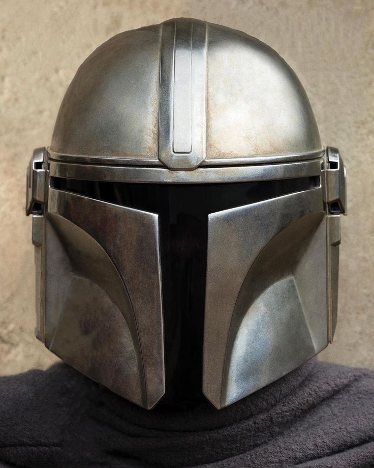 a close up of a helmet on top of a person's head and shoulders