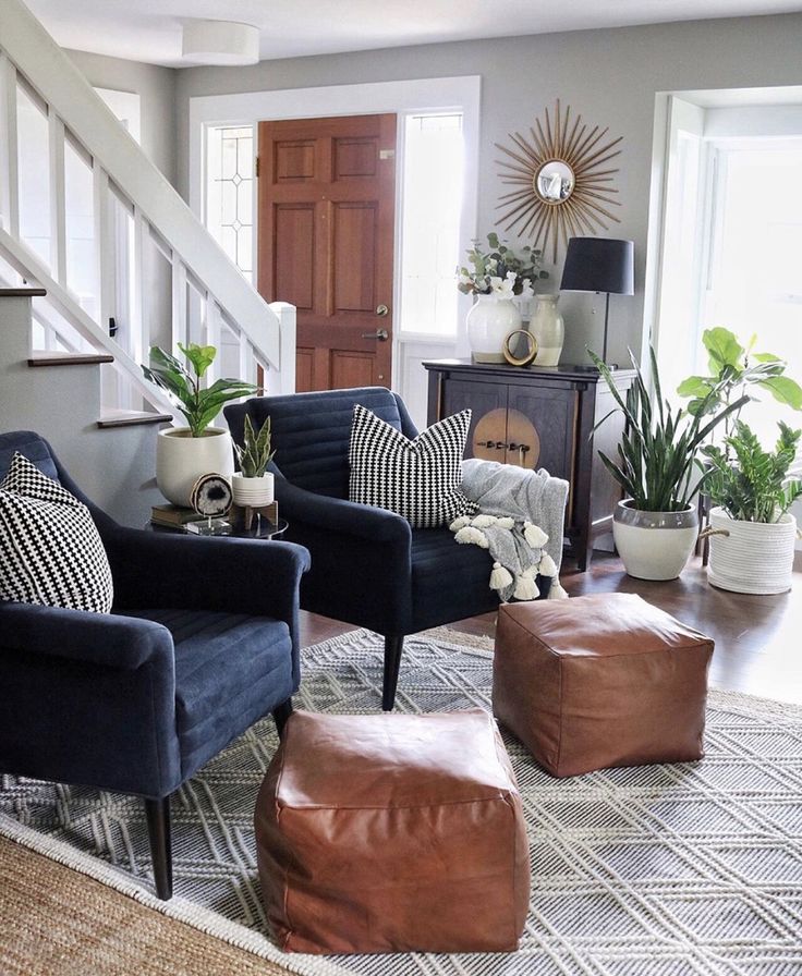 a living room filled with furniture and lots of pillows on top of it's floor