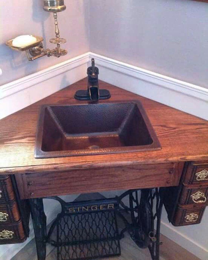 an old sewing machine turned into a sink