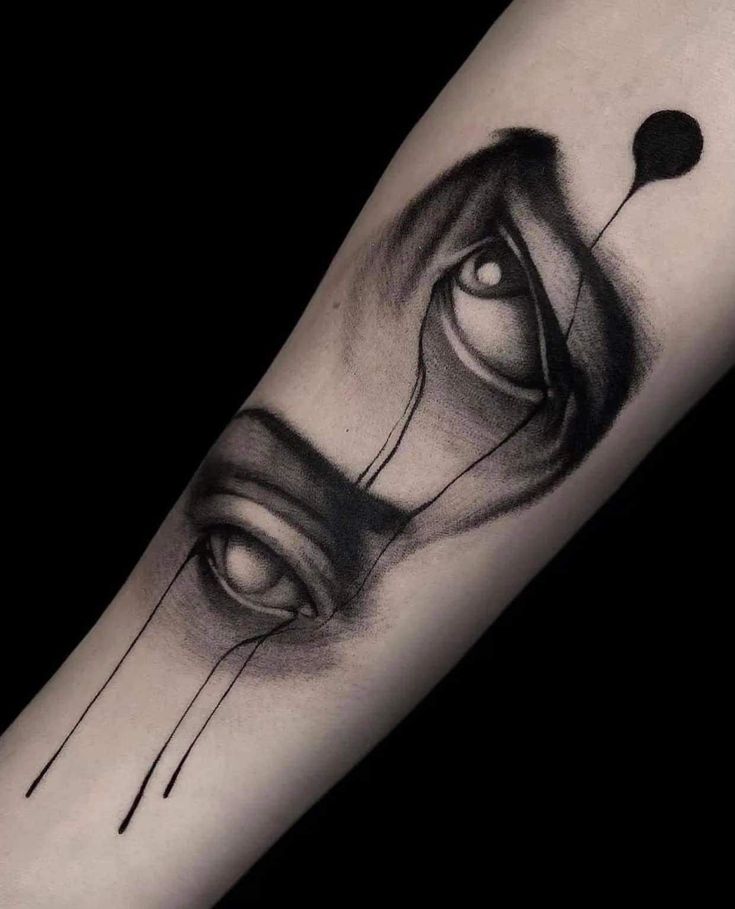 an artistic tattoo design on the arm