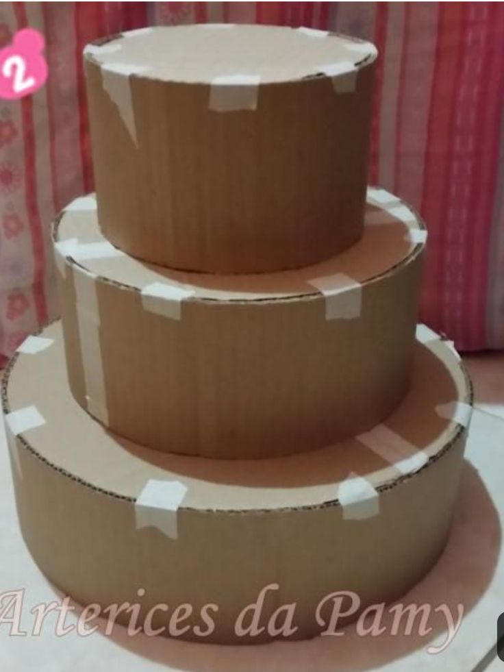 three cardboard boxes stacked on top of each other