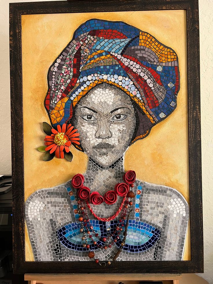 an art piece with a woman wearing a turban and beaded necklaces