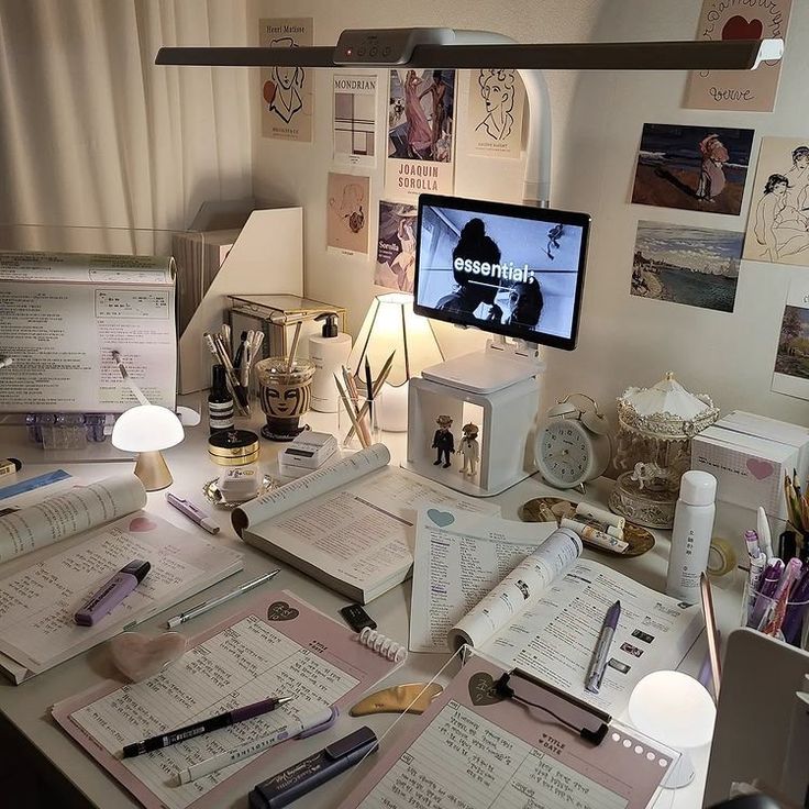 the desk is cluttered with papers, pens and other things to write on it