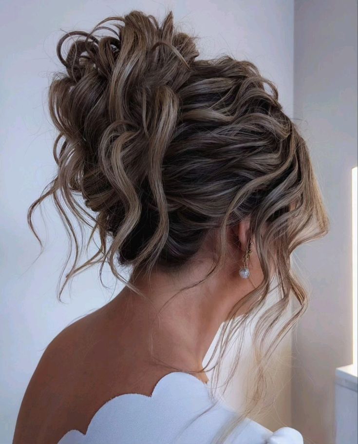 Formal Updos High Bun, High Messy Bridal Updo, Wedding Updos For Long Hair Braid, Textured High Bun Wedding, Messy Bun Formal Updo, Curly High Bun Wedding, High Updo With Braid, Messy Updo Bride, Formal High Updo