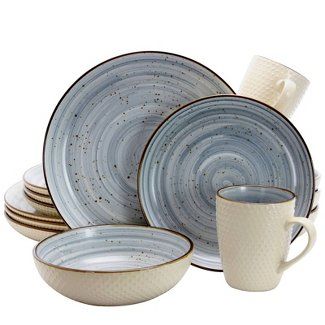 a set of dishes with cups and saucers