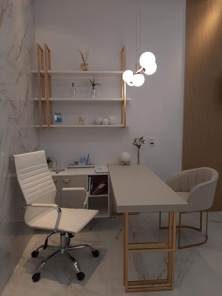 a room with a desk, chair and shelves on the wall next to each other