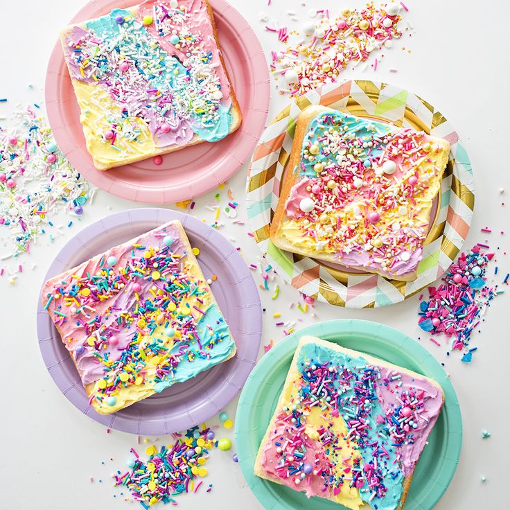 three pieces of cake on plates with sprinkles