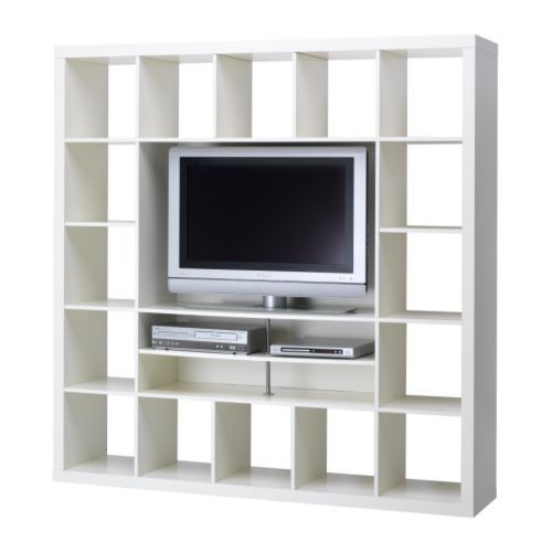 a white bookcase with a tv on it