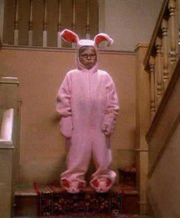 a person in a pink bunny costume standing on stairs