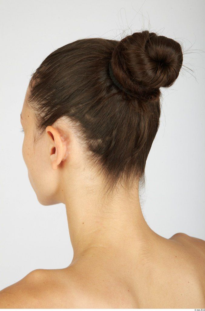 a woman with her hair in a bun