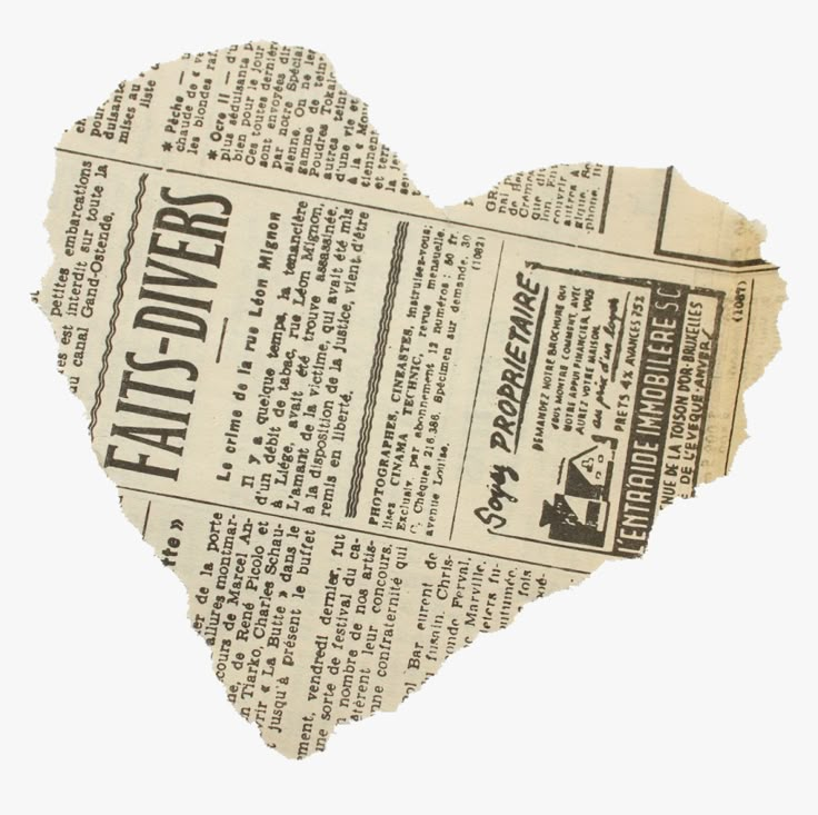 an old newspaper heart cut out into the shape of a paper