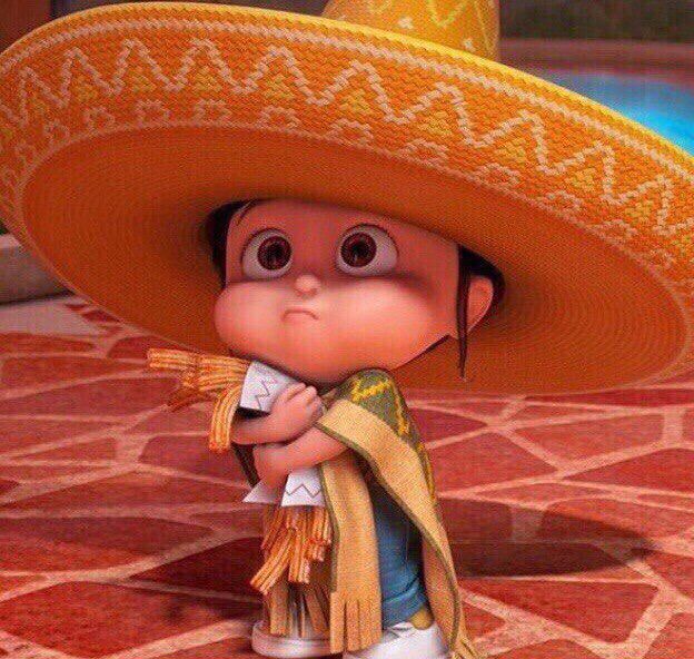 a cartoon character wearing a sombrero and holding a small item in his hand