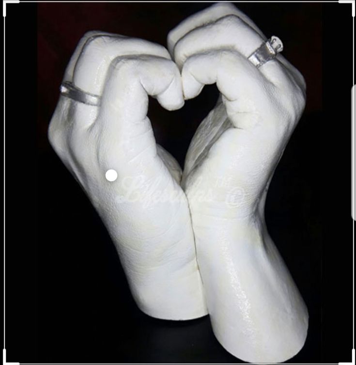 two hands making a heart shape with their fingers