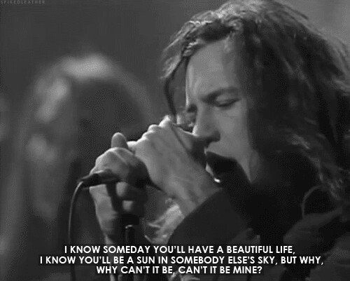 a man with long hair holding a microphone in front of his face and the words, i know somebody you'll have a beautiful life