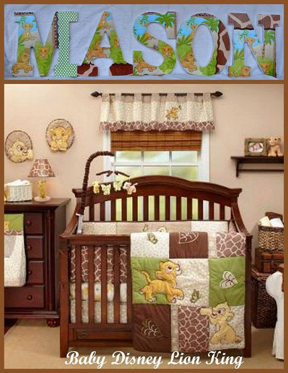 a baby crib in a nursery with winnie the pooh bedding and accessories