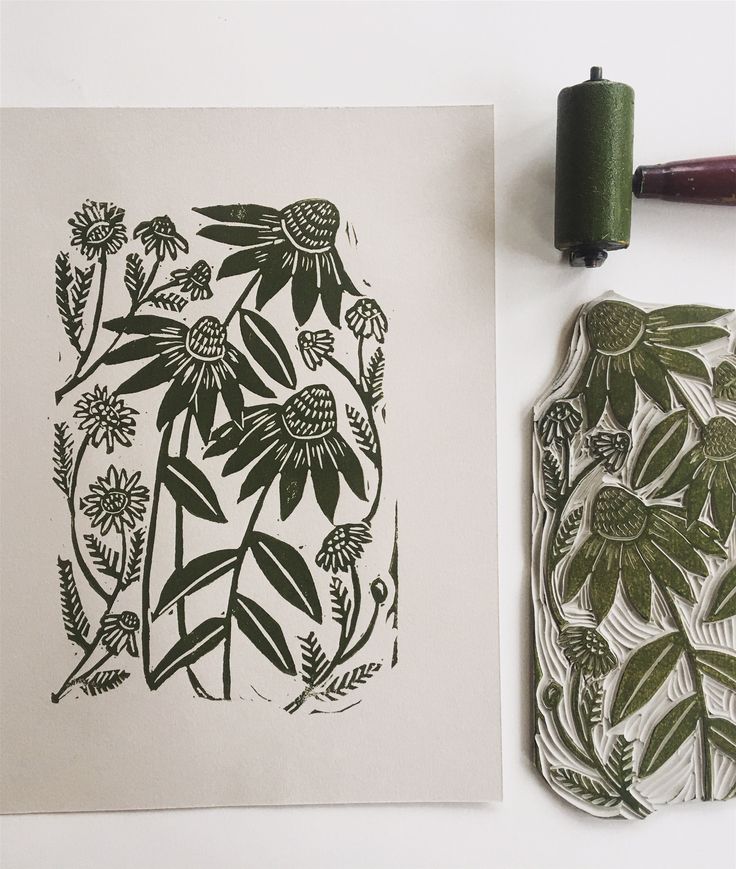 an image of flowers and leaves on paper next to a rubber stamp with crayons