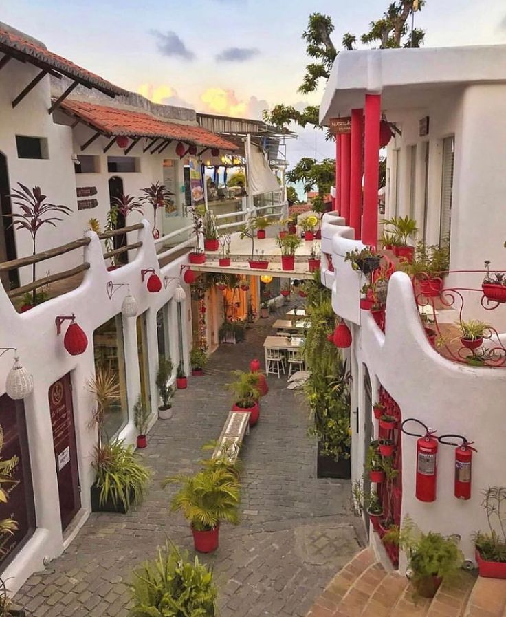 an aerial view of a building with red and white decorations on the walls, windows, and balconies