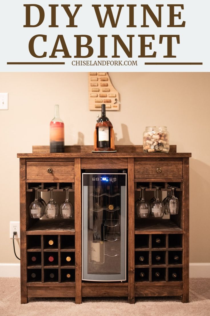 a wooden cabinet with wine glasses and bottles on top