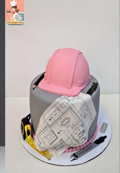 there is a cake with construction hats on it