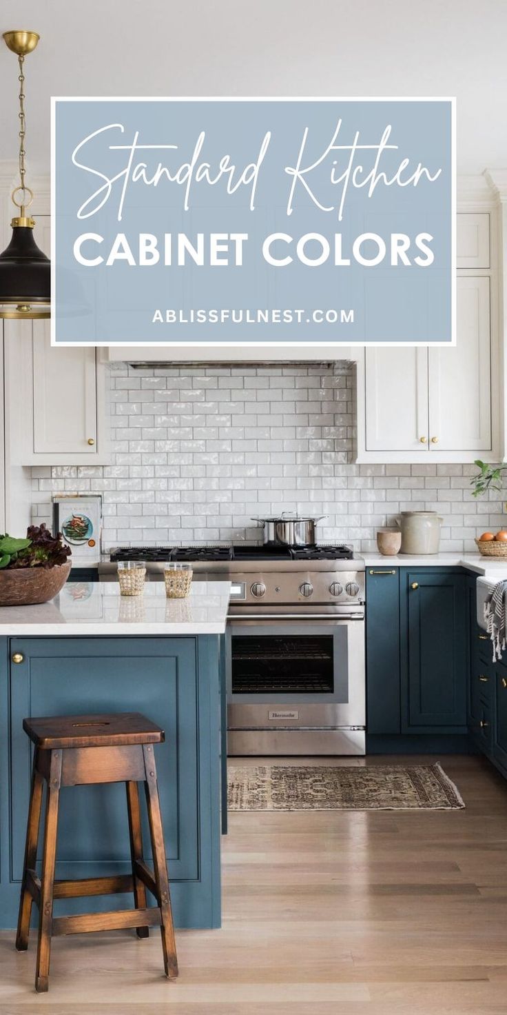 a kitchen with white cabinets and blue island