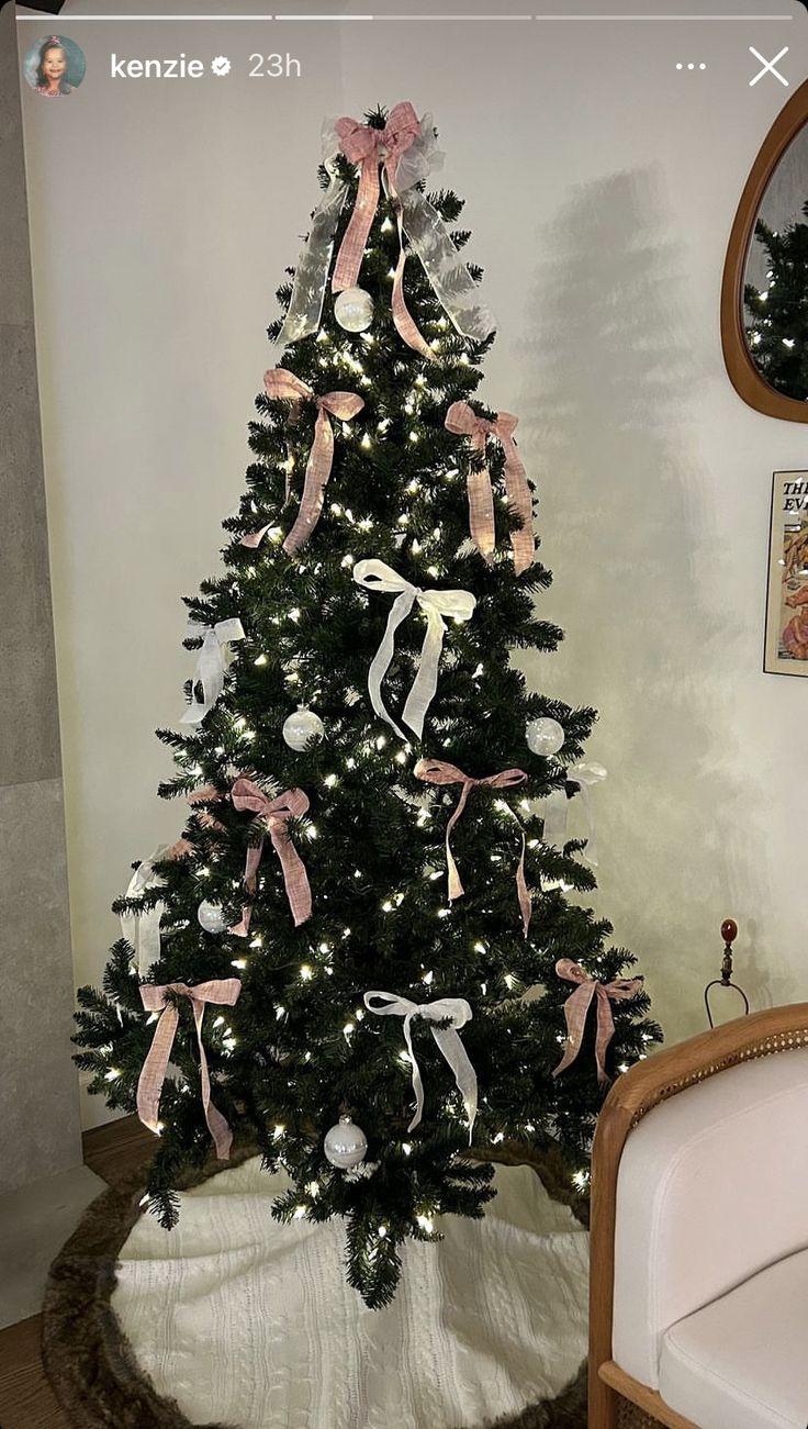 a decorated christmas tree in the corner of a room