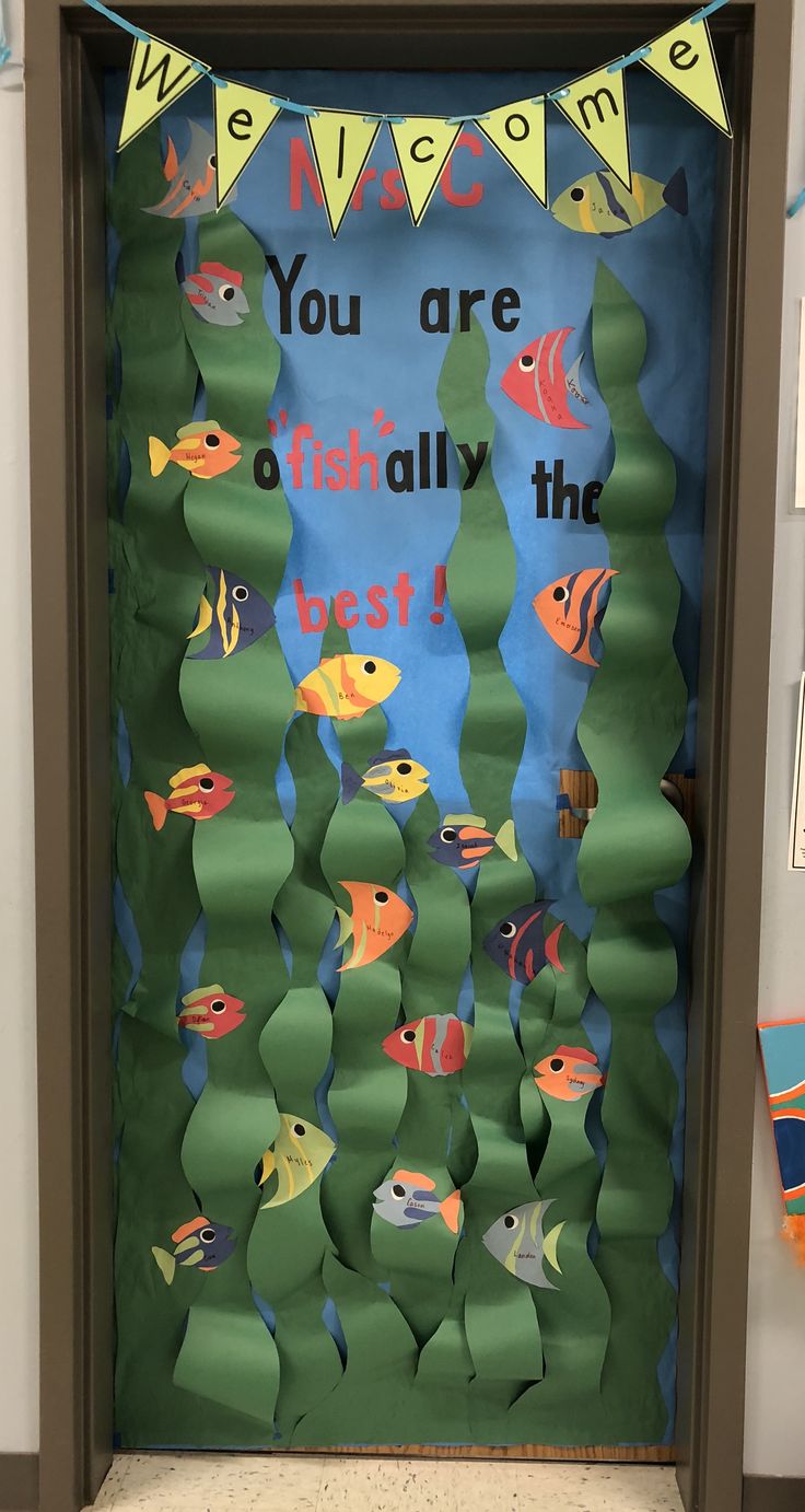 a classroom door decorated with fish and welcome you are totally the best sign on it