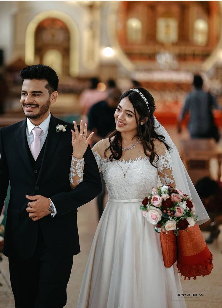 a bride and groom walking down the aisle