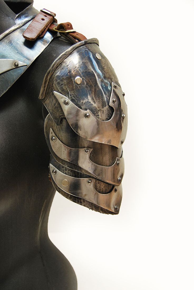 a metal helmet on top of a mannequin's head