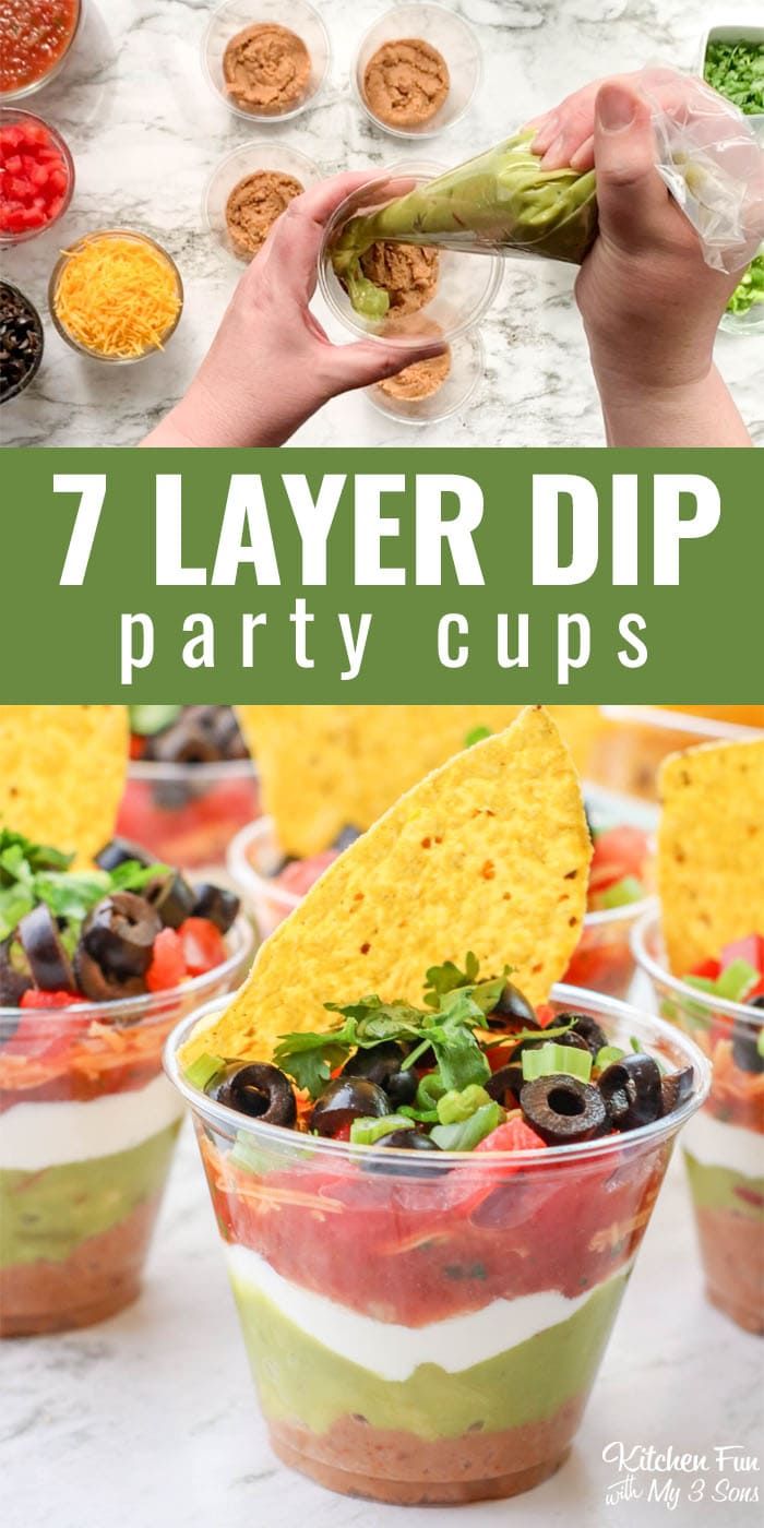 seven layer dip party cups with tortilla chips and guacamole in them